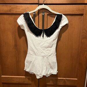 Wear Moi White Leotard with Attached Skirt and Black Appliqué